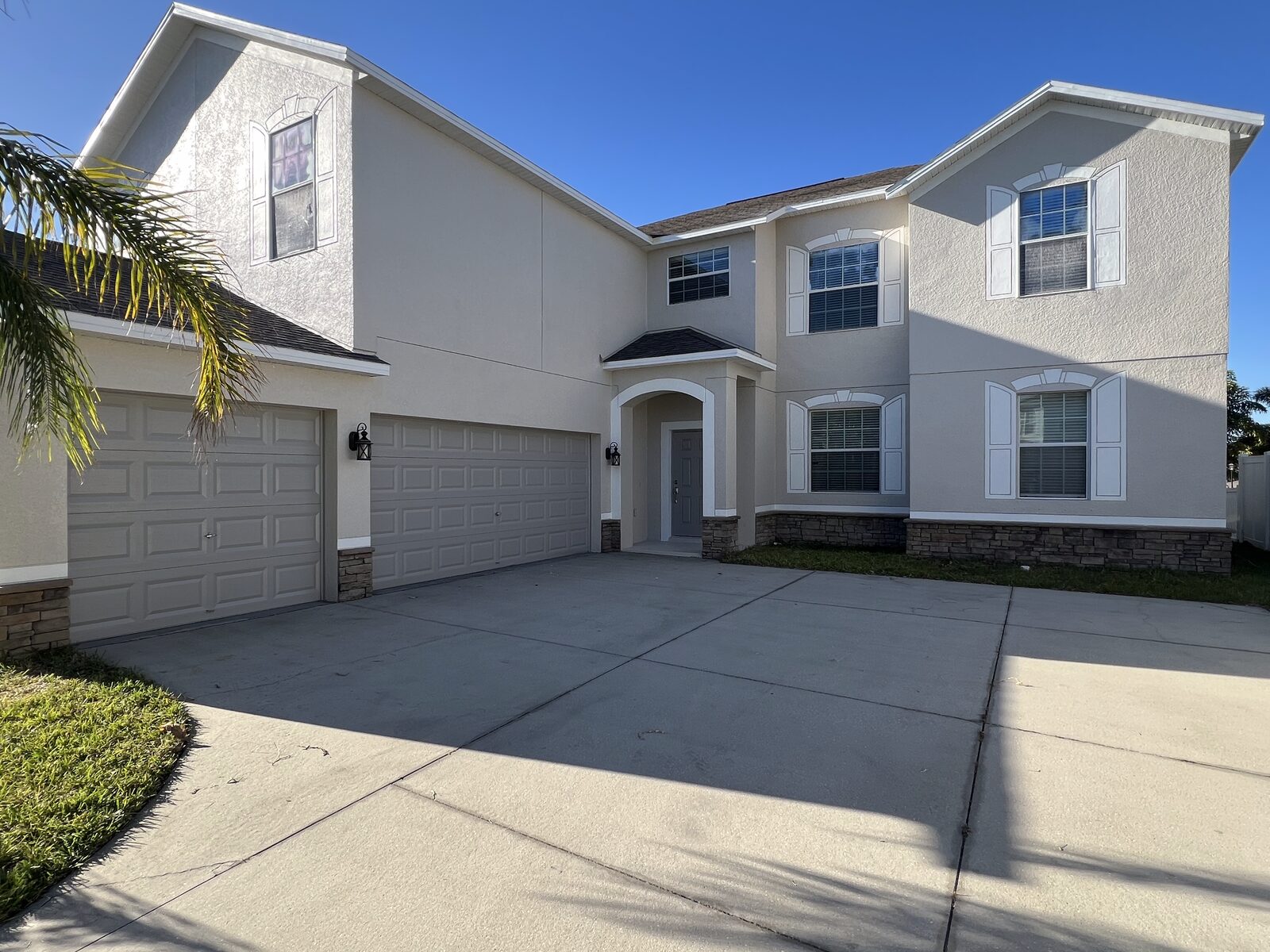Two-story stucco home exterior