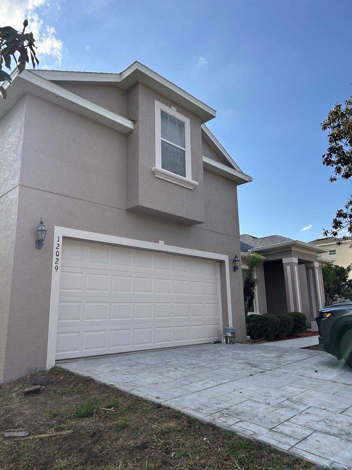 Two-story stucco home with garage